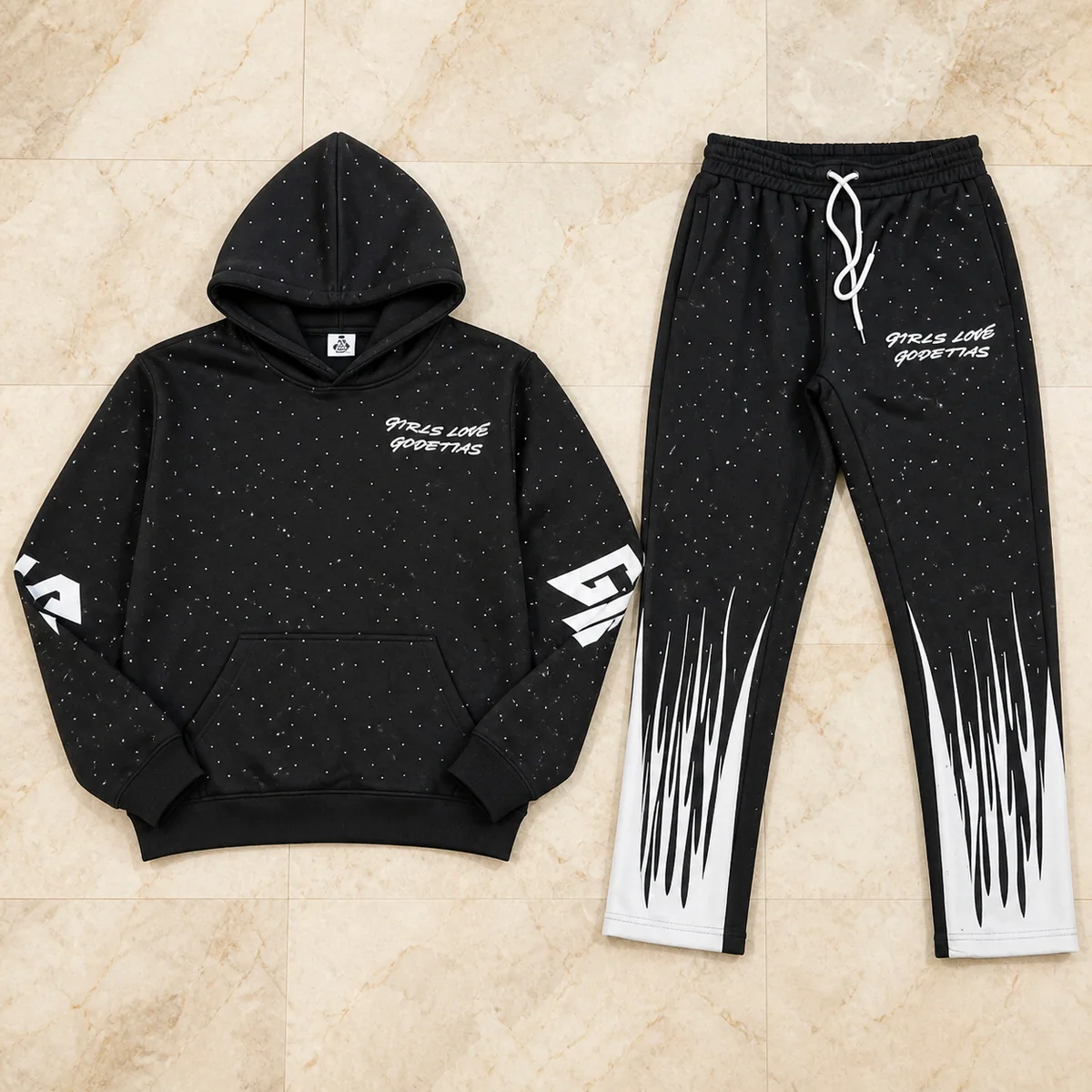 Black printed hoodie and jogger set on marble