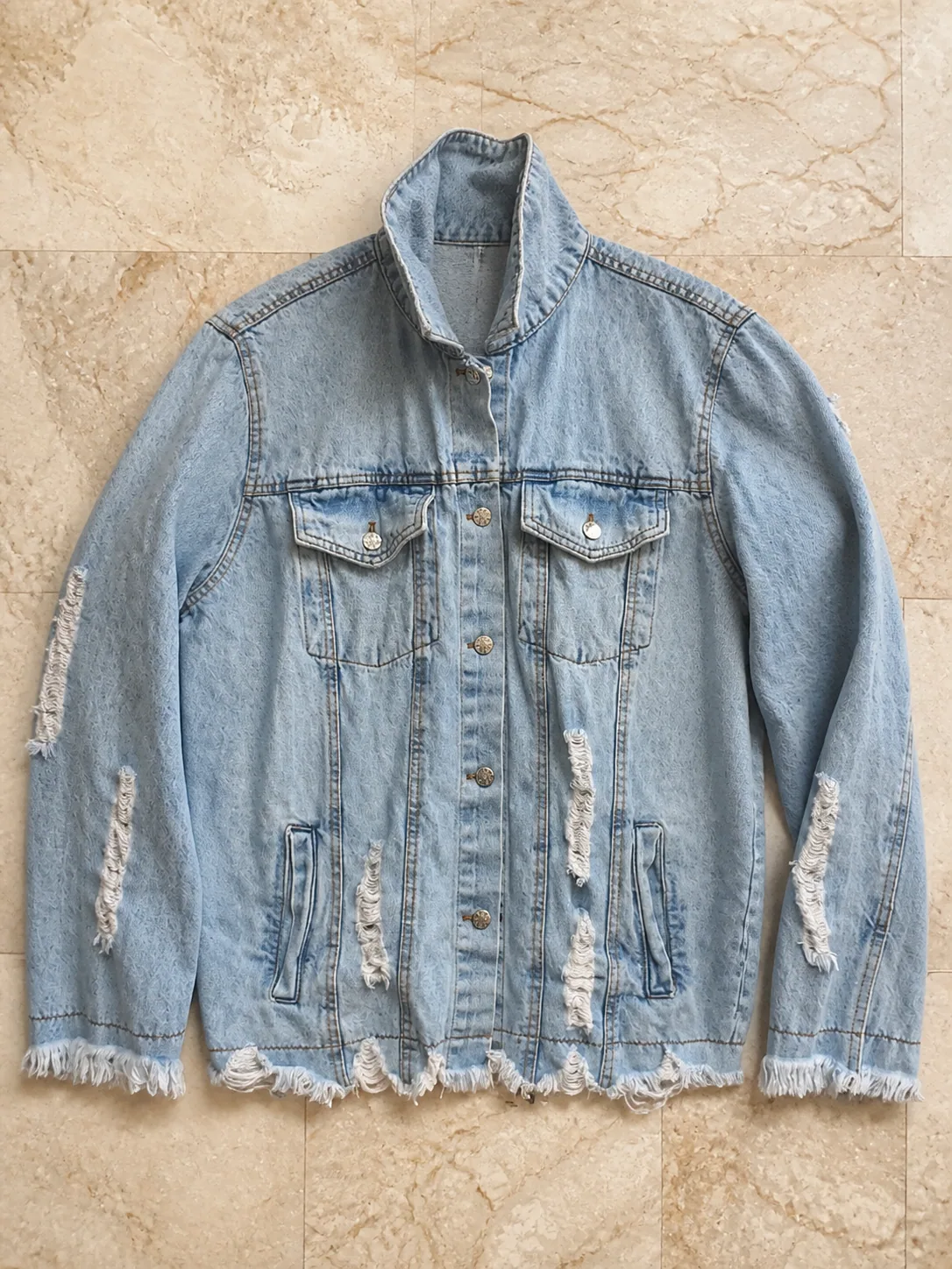 Light wash distressed denim jacket from the United States shipment